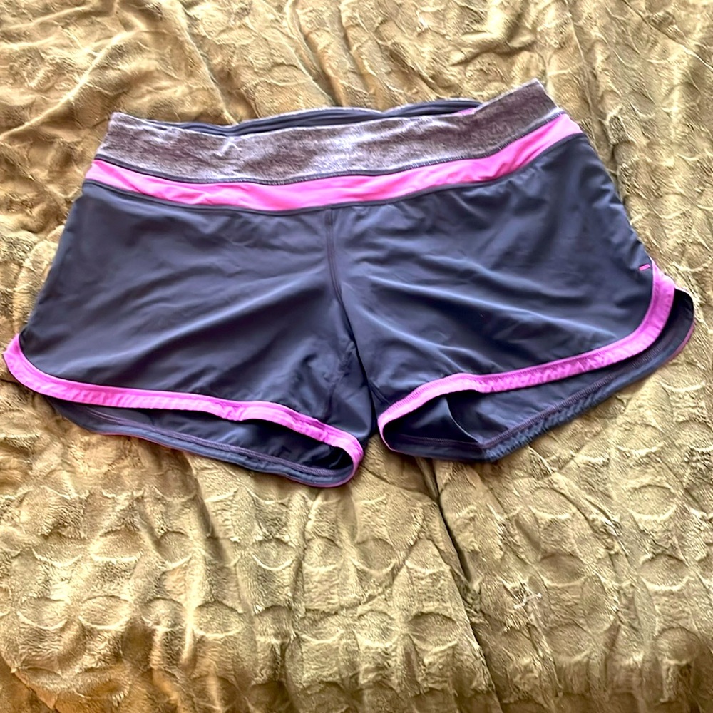 Lululemon gray and purple running shorts with lining.  Back pocket size-8